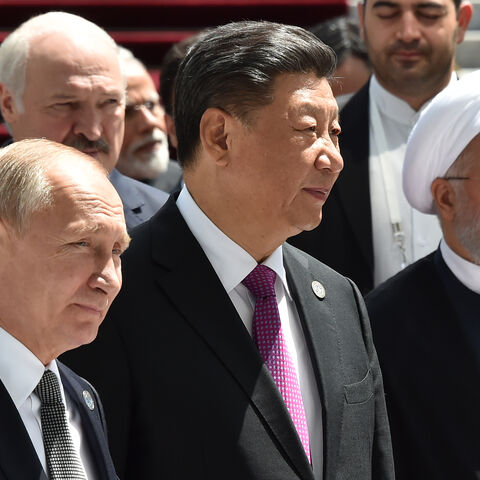 Russian President Vladimir Putin, Chinese President Xi Jinping and Iran's President Hassan Rouhani walk as they attend a meeting of the Shanghai Cooperation Organisation (SCO) Council of Heads of State in Bishkek on June 14, 2019. (Photo by Vyacheslav OSELEDKO / AFP) (Photo credit should read VYACHESLAV OSELEDKO/AFP via Getty Images)