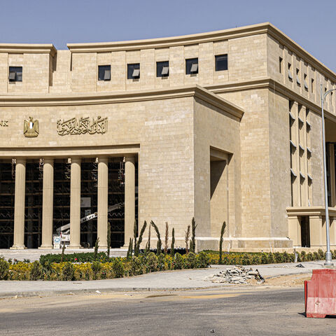 A man walks near the new headquarters of Egypt's Central Bank at the New Administrative Capital megaproject about 45 kilometres east of the current capital Cairo on Aug. 1, 2023.