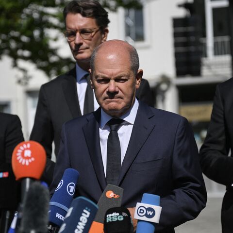 German Chancellor Olaf Scholz addresses media after a visit at the site of a knife attack in Solingen, Western Germany, on August 26, 2024.