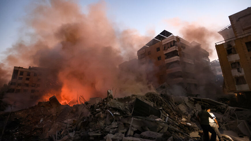 Smoke rises from the smouldering rubble at the scene of Israeli air strikes in the Haret Hreik neighbourhood of Beirut's southern suburbs on September 27, 2024. A source close to Hezbollah said the massive Israeli strikes on Beirut's southern suburbs flattened six buildings. (Photo by Ibrahim AMRO / AFP) (Photo by IBRAHIM AMRO/AFP via Getty Images)