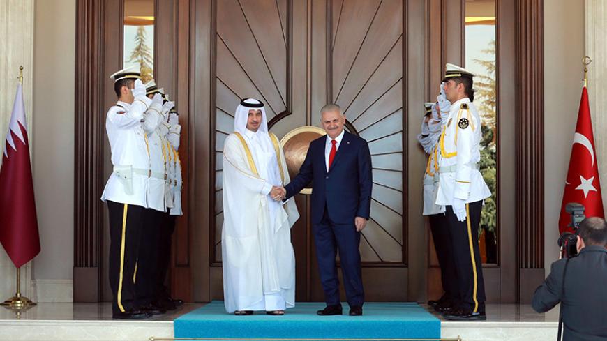 Turkish Prime Minister Binali Yildirim (R) shakes hands with Qatar's Prime Minister Abdullah bin Nasser bin Khalifa Al Thani before their meeting at Cankaya Mansion in Ankara, on September 8, 2016. / AFP / ADEM ALTAN        (Photo credit should read ADEM ALTAN/AFP/Getty Images)