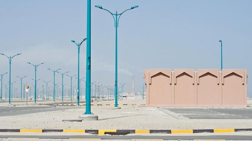 Sand covers the empty infrastructure at an abandoned housing project in Khairan, southern Kuwait March 6, 2014. With a youthful, well-educated population, strong relationships with both neighbours and world powers, and a strategic location on the Gulf, major oil producer Kuwait should be as dynamic a hub for the region as Dubai or Doha. But while others in the Gulf have powered ahead, attracting foreign investment and developing infrastructure, Kuwait has stagnated, frustrating the people of a country once 