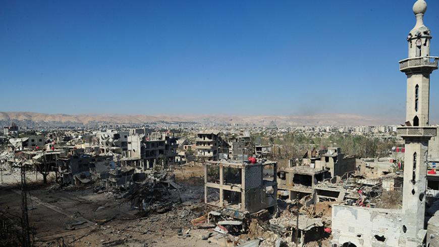A view shows a part of the al-Dukhaneya neighborhood near Damascus after soldiers loyal to Syria's President Bashar al-Assad took control of it from rebel fighters, October 6, 2014, in this handout released by Syria's national news agency SANA. REUTERS/SANA/Handout via Reuters (SYRIA - Tags: CIVIL UNREST POLITICS CONFLICT TPX IMAGES OF THE DAY) ATTENTION EDITORS - THIS PICTURE WAS PROVIDED BY A THIRD PARTY. REUTERS IS UNABLE TO INDEPENDENTLY VERIFY THE AUTHENTICITY, CONTENT, LOCATION OR DATE OF THIS IMAGE. 