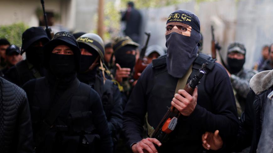 Islamic Jihad militants attend the funeral of Palestinian Jehad Hararah who was killed at the Israeli-Gaza border fence, in Gaza City March 23, 2019. REUTERS/Mohammed Salem - RC1B410D6340