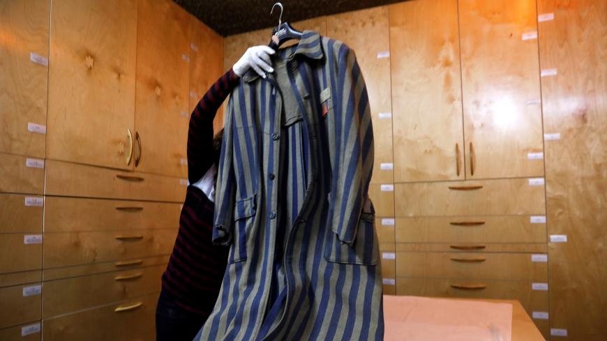 An original prisoner's coat (not on general display) is seen at the artifacts department of the Yad Vashem World Holocaust Remembrance Center in Jerusalem, ahead of the Israeli annual Holocaust Remembrance Day, April 10, 2018. Picture taken April 10, 2018. REUTERS/Ronen Zvulun - RC1A0B40CE00