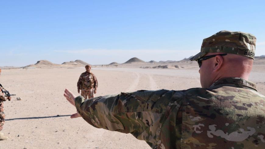 Master Sgt. Richard Harris, 149th Military Engagement Team, Kentucky National Guard, places Royal Army of Oman soldiers in different formations to demon-strate tactical movement for a variety of scenarios during a Mountain Warfare Information Exchange, May 9, 2017, near Salalah, Oman. (U.S. Army Photo by Staff Sgt. Joshua Atanovich, 149th Military Engagement Team)